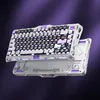 A futuristic-looking mechanical keyboard is shown floating against a purple gradient background. Náhled obrázku produktu