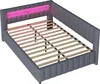 A gray upholstered bed frame with a pink LED light strip in the headboard, shown from a diagonal top-down perspective. Náhled obrázku produktu