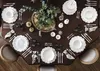 A beautifully set dining table with festive decorations, suggesting a holiday meal. Produktbild-Vorschau