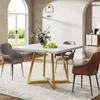 A dining table with chairs in a well-lit room. Produktbild-Vorschau