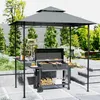 A backyard patio scene with a grill gazebo, barbecue grill, and outdoor furniture. Produktbild-Vorschau