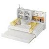 A white multifunctional sofa bed with a pull-out trundle bed and a built-in bookshelf and corkboard headboard. Produktbild-Vorschau
