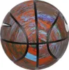 A close-up, studio shot of a basketball with a multi-colored, abstract design. Produktbild-Vorschau