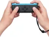 Hands holding a Nintendo Joy-Con controller. Produktbild-Vorschau