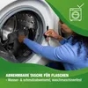 A person is loading laundry into a washing machine. Produktbild-Vorschau