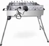 A stainless steel electric grill with skewers and a motor, shown on a white background with its legs extended.