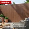 A garden fence with outdoor furniture and plants. Produktbild-Vorschau