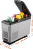 A portable car refrigerator with its lid open, showing cans of soda, grapes, a lemon, and an apple inside. Dimensions are indicated with text overlays. Produktbild-Vorschau