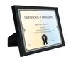 A framed certificate of excellence is displayed on a white background with a black stand. Produktbild-Vorschau