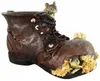 A decorative boot with mice peeking out, filled with straw. Produktbild-Vorschau