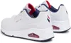 A pair of white SKECHERS UNO women's sports shoes with red and blue accents. Produktbild-Vorschau