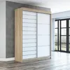A modern sliding door wardrobe is shown in a room with a concrete wall and wooden floor. Produktbild-Vorschau