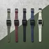 Five Casio calculator watches in different colors arranged diagonally on a textured surface. Produktbild-Vorschau