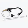 A black kitchen faucet and its components are laid out on a white background. Produktbild-Vorschau