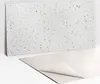 A white speckled panel leaning against a white surface, with a light gray sheet partially underneath it. Náhľad obrázku produktu