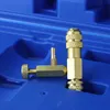 Close-up of a brass tool with a ribbed handle and a hose barb, resting in a blue plastic case. Podgląd zdjęcia produktu