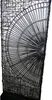 A close-up view of a black metal floor lamp with a fan-like design. Náhled obrázku produktu