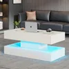 A modern living room with a white coffee table with LED lighting in front of a dark gray sofa. Produktbild-Vorschau