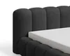 A close-up view of a black upholstered bed frame with a white mattress. Voir les images du produit