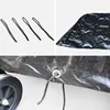 A collage of images showing details of a black outdoor table tennis table cover, including tie-down cords and a grommet with a cord. Produktbild-Vorschau