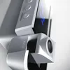 A close-up, detailed view of a modern electronic device, likely a projector or alarm clock, with a focus on its design and controls. Produktbild-Vorschau
