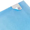 A close-up view of a blue disposable pet training pad with a corner peeled back to reveal a white backing. Náhľad obrázku produktu