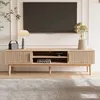 A modern living room scene featuring a TV stand with a television mounted above it. Produktbild-Vorschau