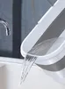 Water being poured from a bucket into a sink. Podgląd zdjęcia produktu