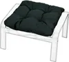 A dark cushion on a white wooden ottoman. Produktbild-Vorschau