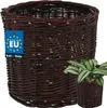 A woven basket with a plant inside, placed on a white background. Produktbild-Vorschau