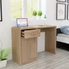 A wooden desk with a laptop, a lamp, and a plant is placed in a room with a window and a bed in the background. Produktbild-Vorschau