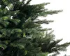 A close-up view of the branches and needles of an artificial Christmas tree. Voir les images du produit