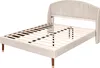 A beige upholstered bed frame with a slatted base, shown from a side-angle. Produktbild-Vorschau