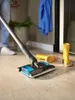 A person is using a vacuum cleaner on a wooden floor. Voir les images du produit
