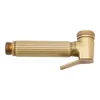 A gold-colored handheld bidet sprayer with a ribbed handle and a trigger. Podgląd zdjęcia produktu