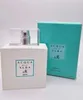 A white perfume bottle and its teal box are displayed against a white background. Náhled obrázku produktu