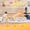 Two children playing on a wooden climbing structure indoors. Náhled obrázku produktu