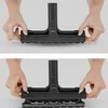 Hands manipulating a black vacuum cleaner attachment. Produktbild-Vorschau
