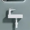 A white ceramic sink with a white faucet mounted on a light gray wall. Anteprima dell’immagine prodotto