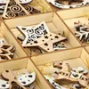 A close-up view of wooden Christmas tree ornaments in a wooden box. Produktbild-Vorschau