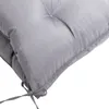 A close-up view of a gray cushion with visible stitching and ties. Voir les images du produit