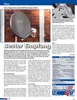 A satellite dish mounted on a brick wall, with text and a table of specifications. Produktbild-Vorschau