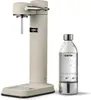 A sand-colored Aarke Carbonator 3 soda maker with a clear PET bottle filled with water. Produktbild-Vorschau