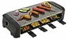 A raclette grill with food cooking on it. Produktbild-Vorschau