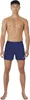 A full-body studio shot of a man wearing navy swim shorts. Podgląd zdjęcia produktu