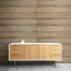 A modern sideboard with wooden doors and drawers is placed against a wood-paneled wall. Náhled obrázku produktu