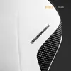 Close-up shot of a white and black gaming chair with textured grip. Anteprima dell’immagine prodotto