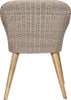 The back view of a wicker chair with wooden legs on a white background. Náhled obrázku produktu