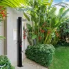 An outdoor shower in a lush garden setting. Náhľad obrázku produktu