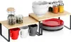 A kitchen shelf organizer with various kitchen items like bowls, plates, mugs, and jars. Produktbild-Vorschau